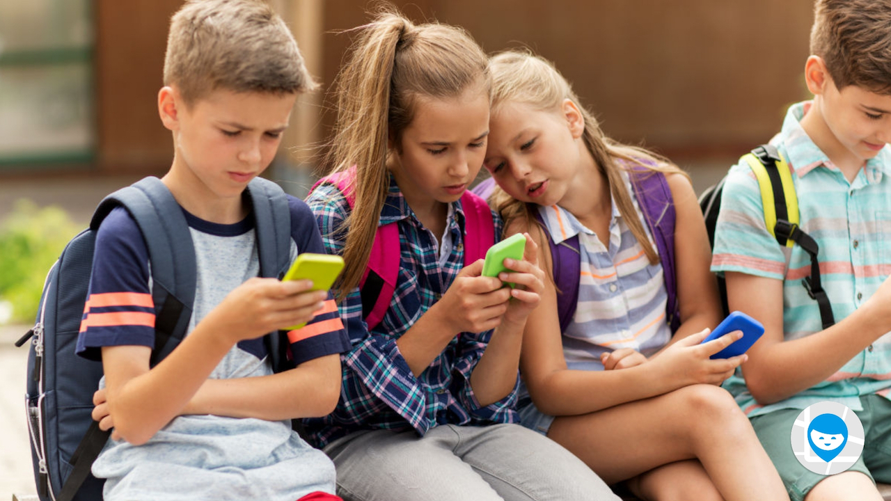 kids sit with phones