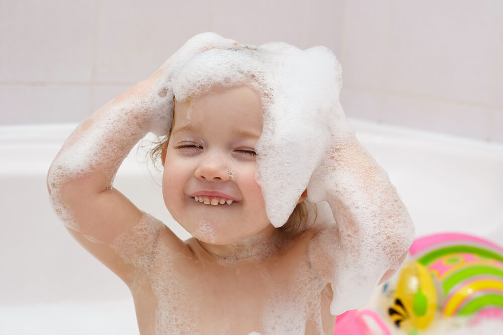 child showering