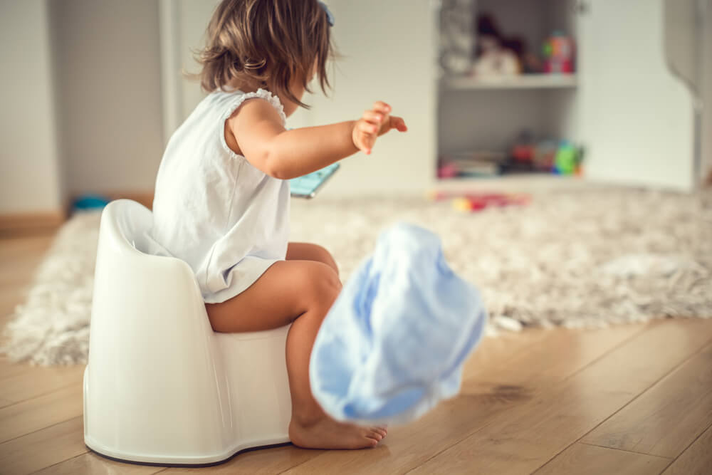 outside little girl on the potty